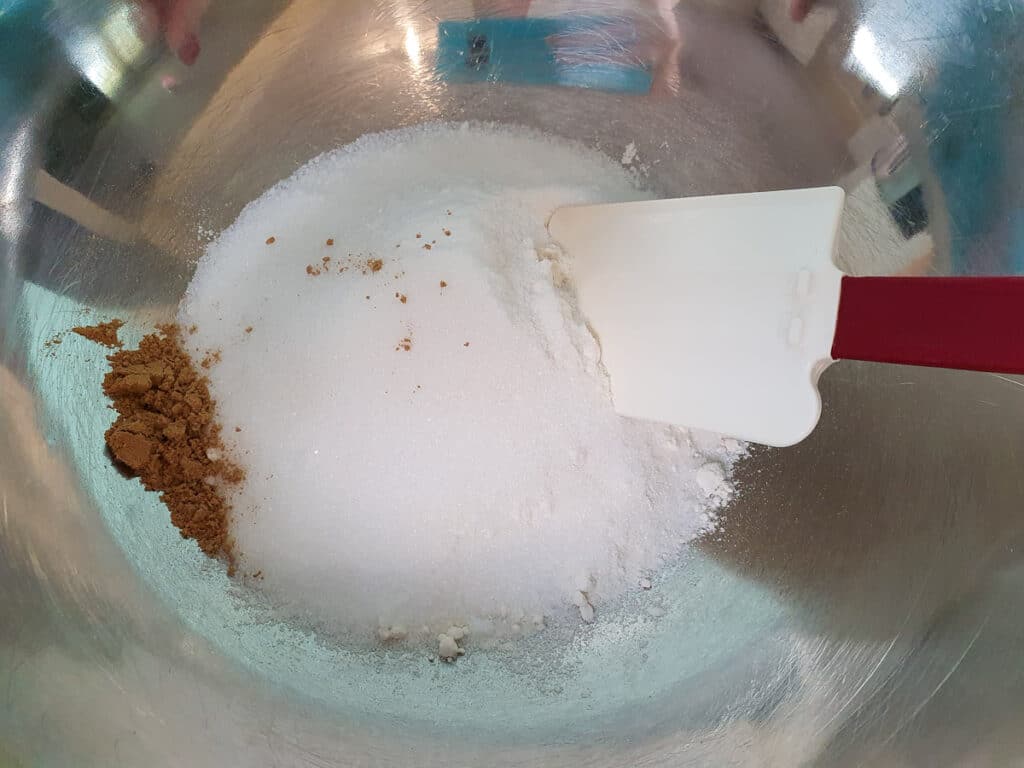 Stirring dry ingredients before adding butter to base.