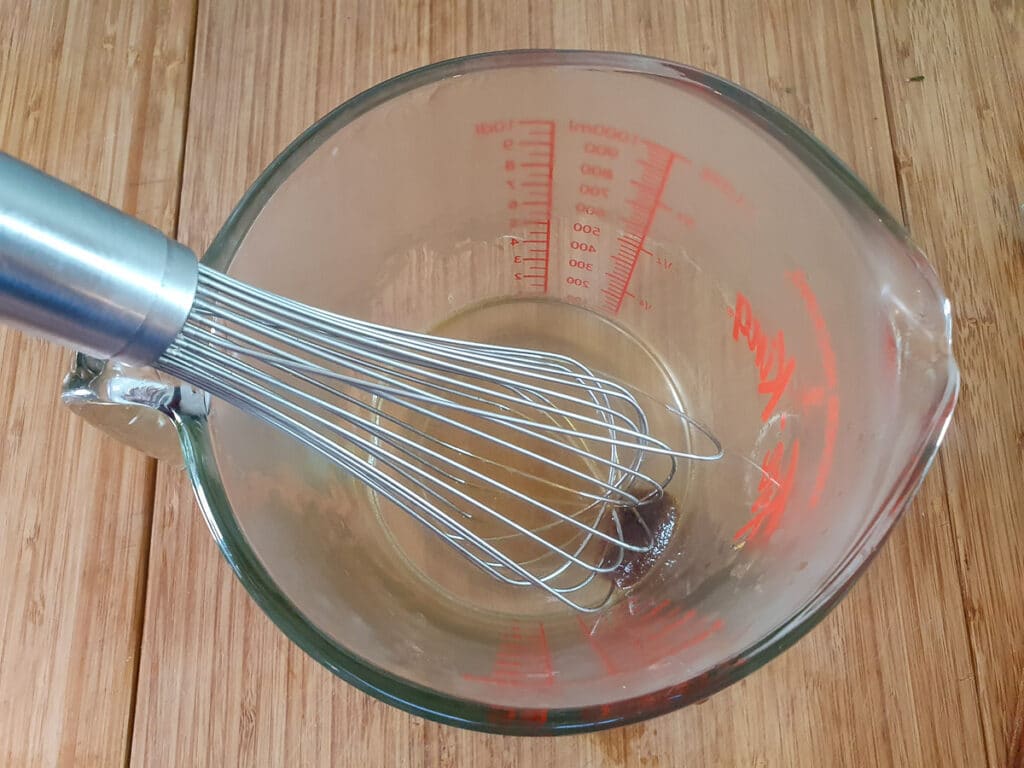 Slow cooker lamb ragu 13 Whisking stock cube in boiling water to dissolve.